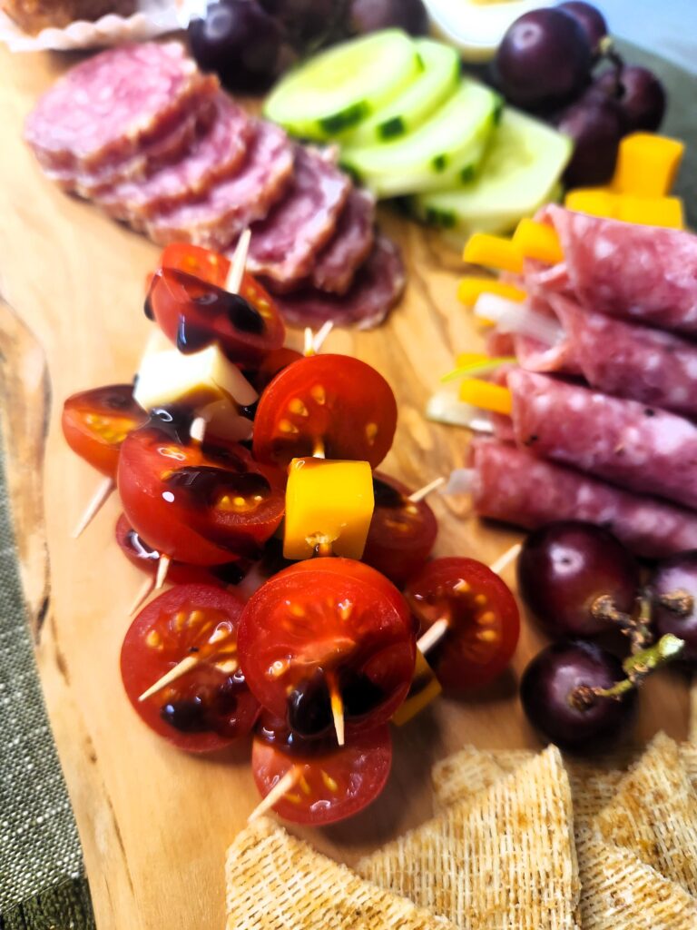 Tomatoes and Cheese with Balsamic Glaze featured on our Kick'n Kitchen's Ultimate Charcuterie Board
