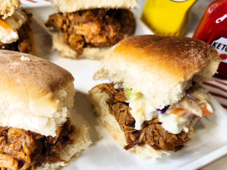 Easy BBQ Pulled Pork Sliders platted and ready for any potluck or gameday feast.