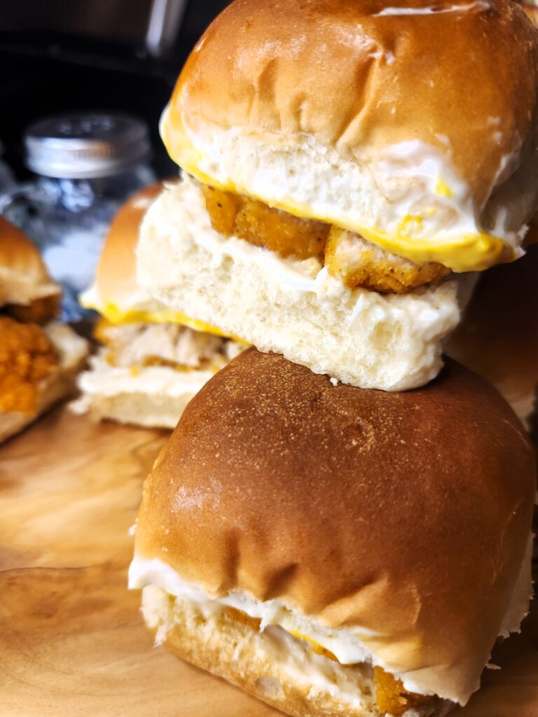 Popcorn Chicken Sliders piled high and ready to be eaten.