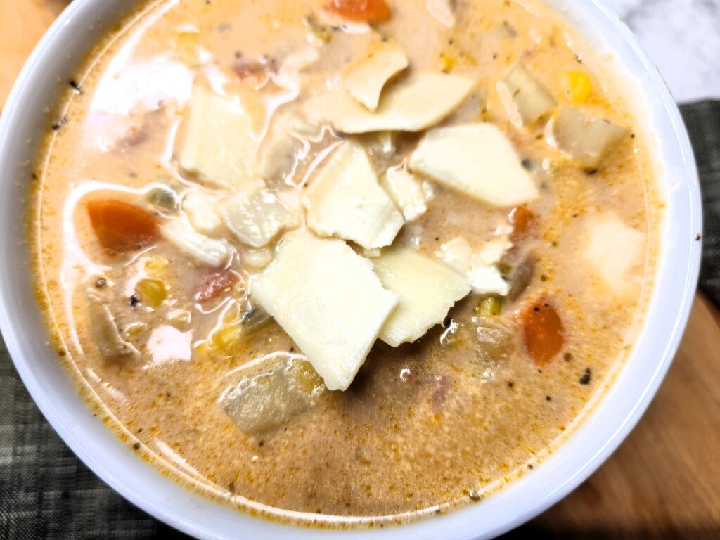 Chicken and Veggie Chowder with parmesan garnish.