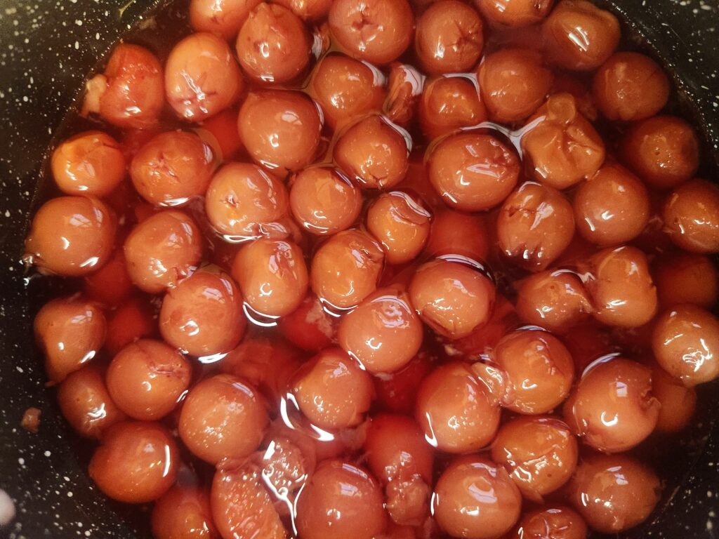 Combine tart cherries, sugar, and vanilla for Tart Cherry Pie Filling