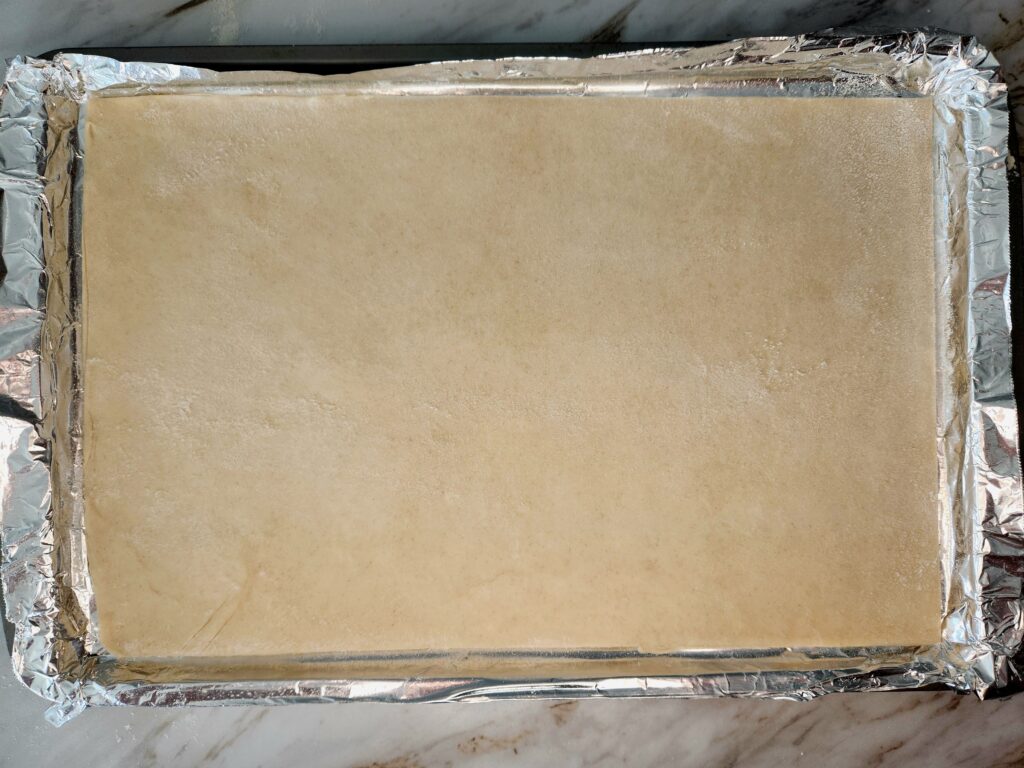 Puff Pastry rolled into cookie sheet