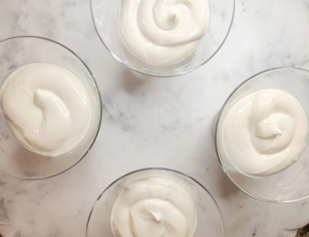 First layer of yogurt in Chocolate Chip Coconut Parfait