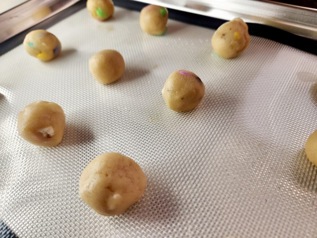 Roll dough into balls for Easter Bunny Cookies