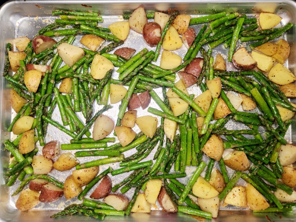 Add asparagus to sheet pan and bake, Sheet Pan Steak and Veggie Dinner