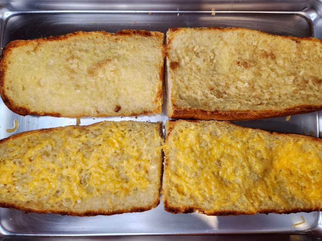 Return bread to oven and broil